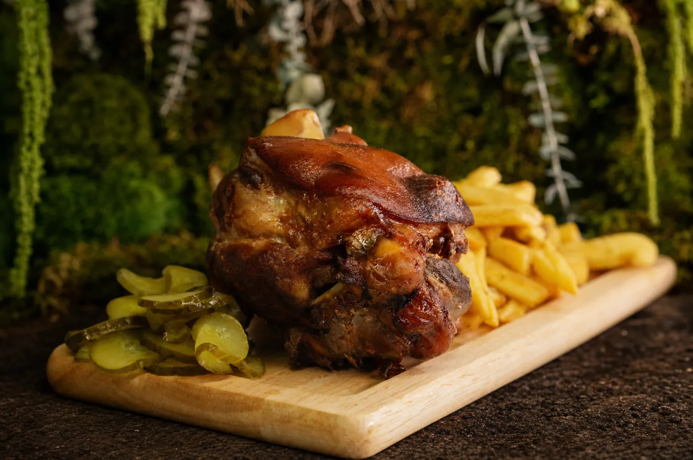 Roast pork knuckle with fries and pickles