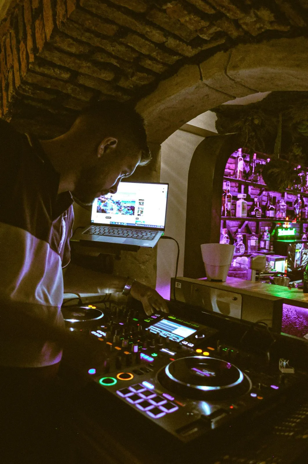 The DJ desk in the stone archway