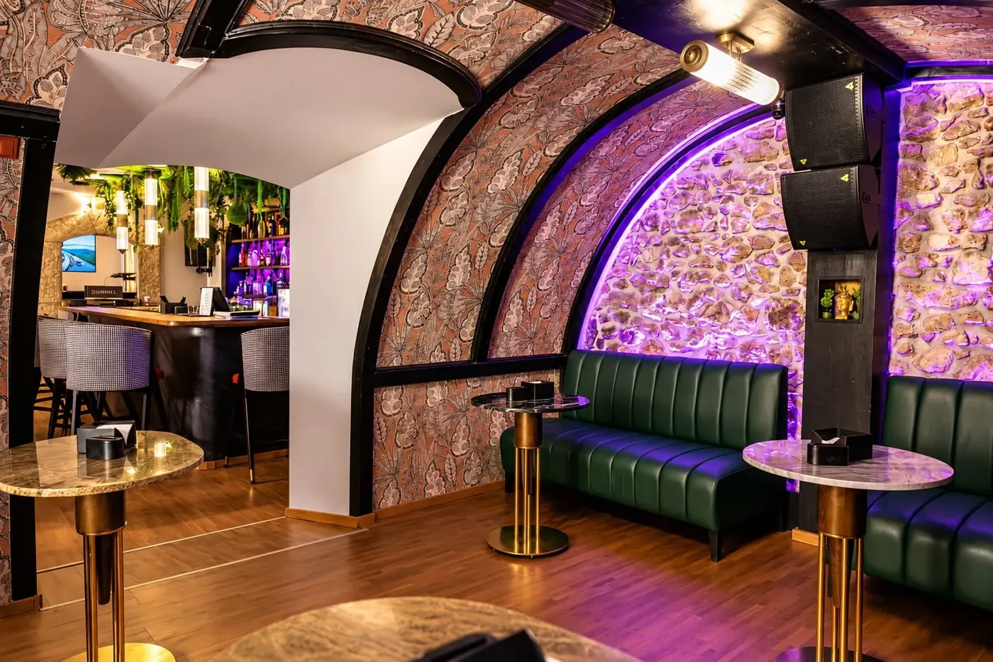 Green leather booths under the arches