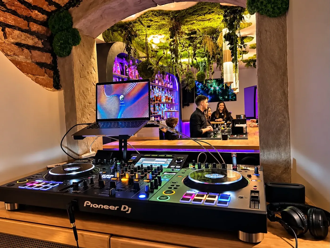 The DJ desk under the moss ceiling
