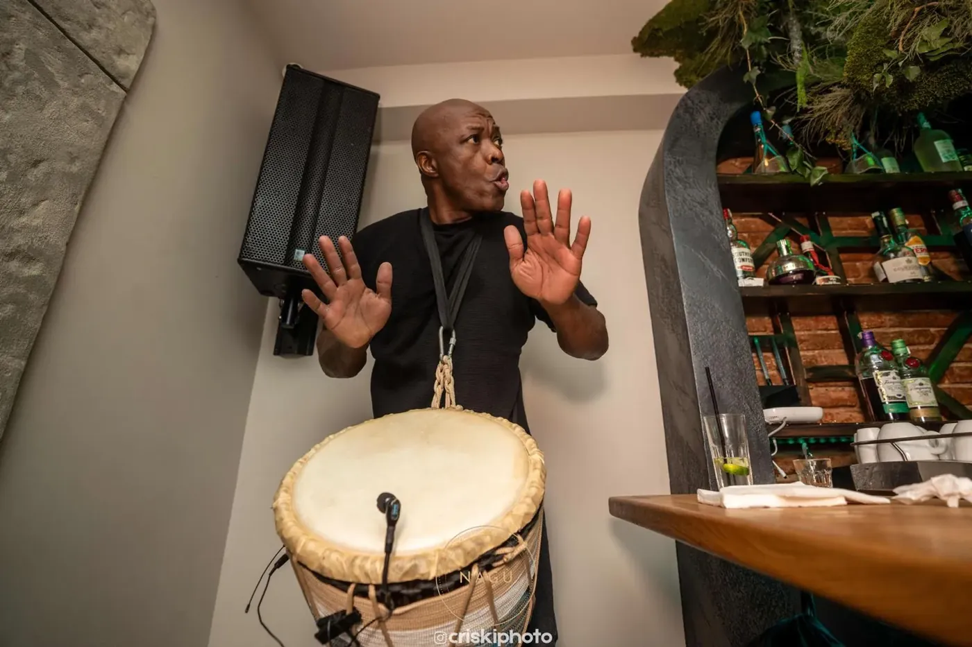 A percussionist playing live at the bar